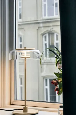 Nuura Blossi table lamp, Nordic gold - clear