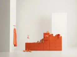 String Furniture Relief chest of drawers with legs, low, orange